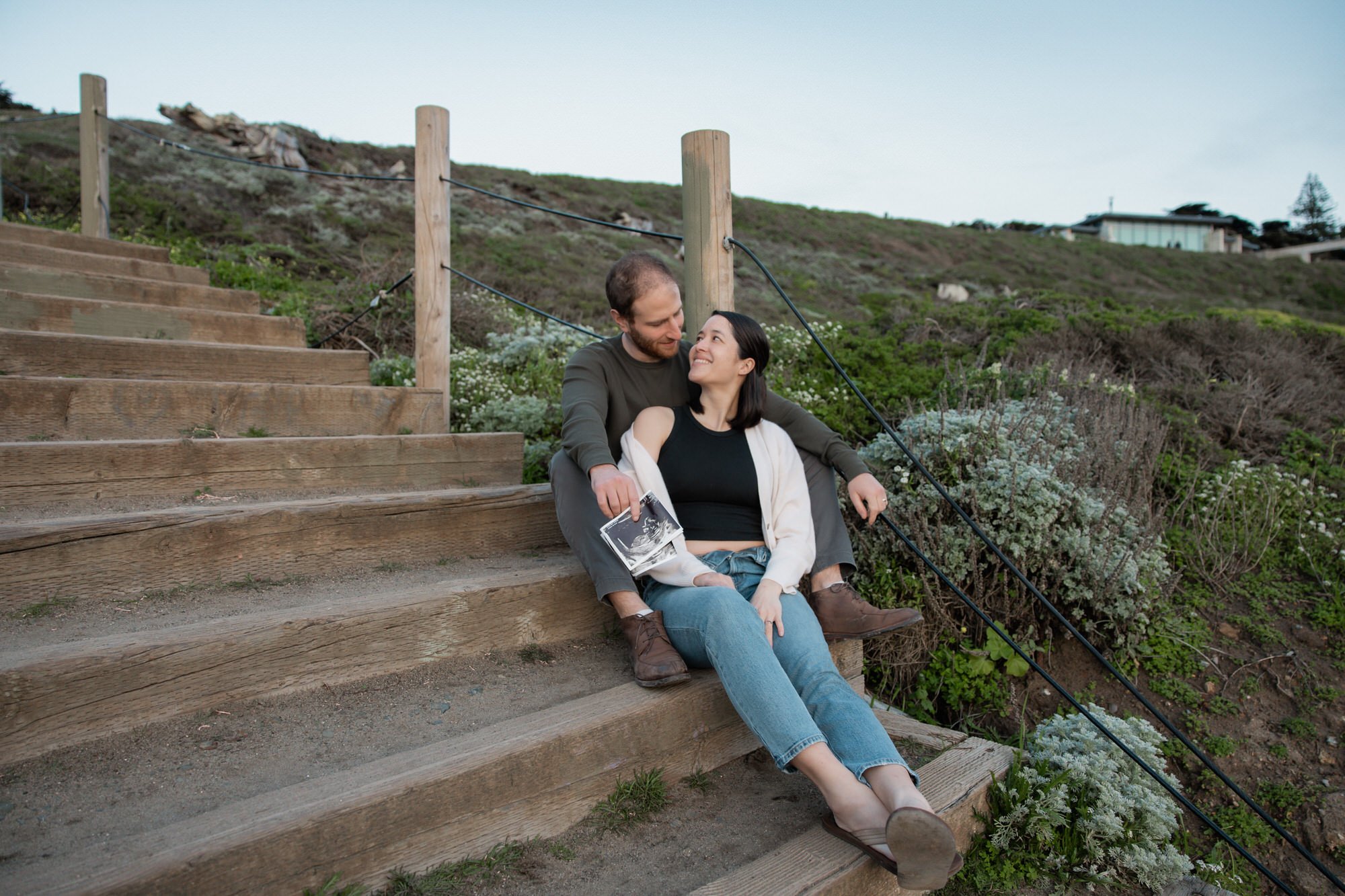 Couple looking at each other on the stairs going down to Sutro Baths